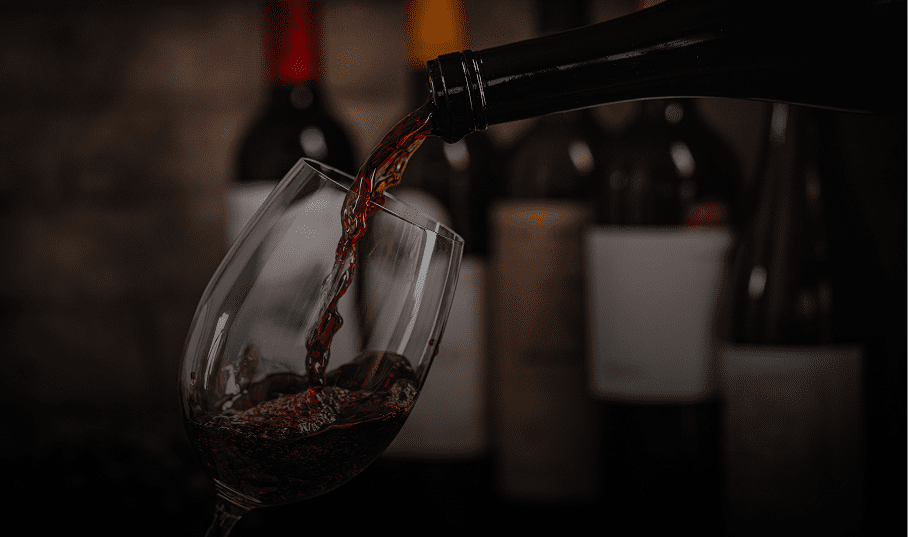 Red wine being poured into a glass.